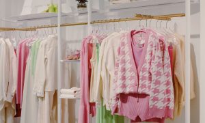 clothes hanging in a department store.