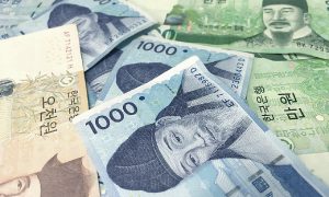 Yellow, blue and green Korean paper money.