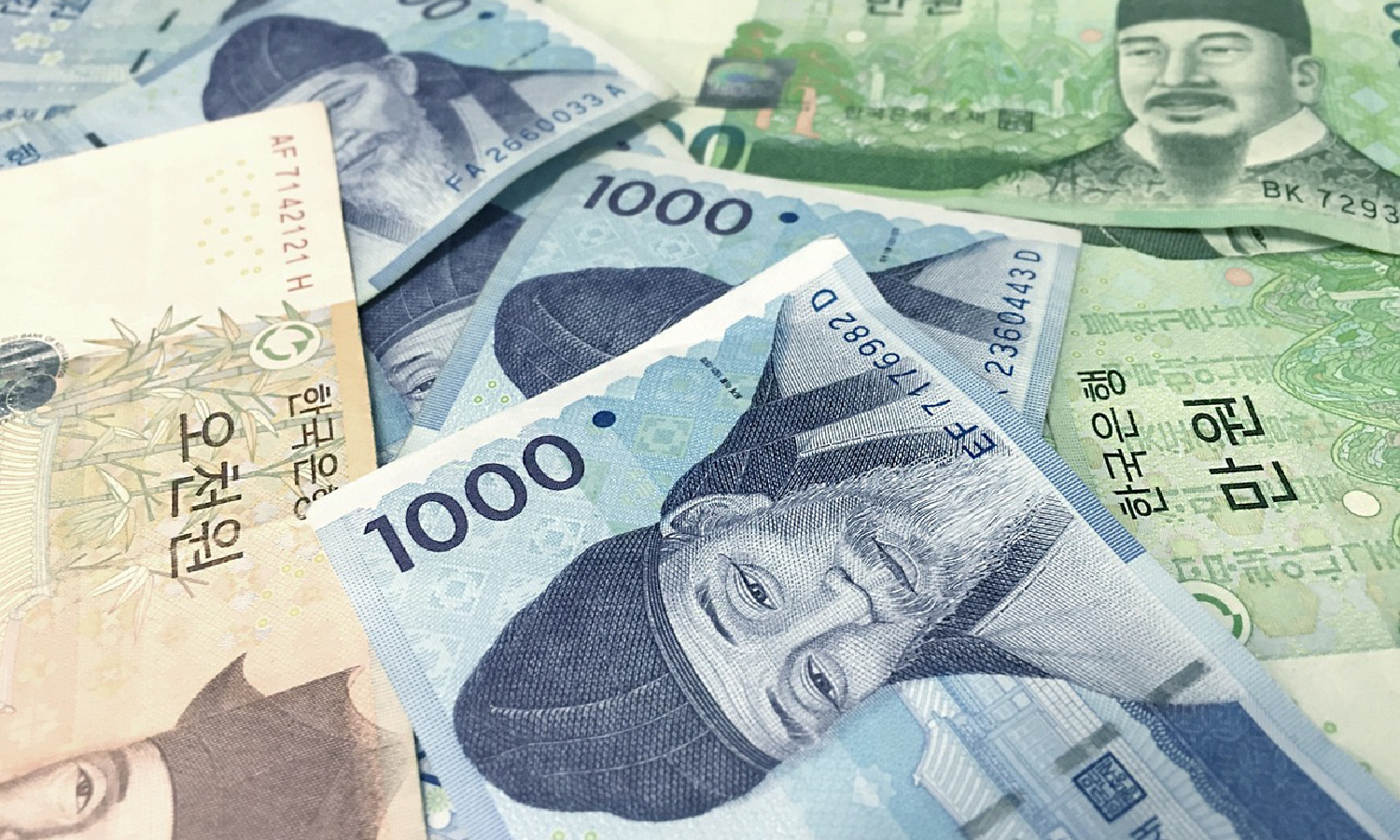 Yellow, blue and green Korean paper money.