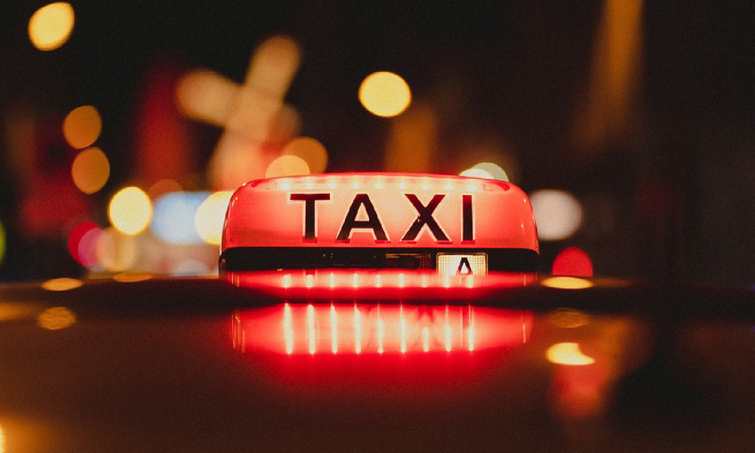 A taxi with the available light switched on.