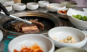 Traditional Korean meat dish prepared and served on the table in bowls.