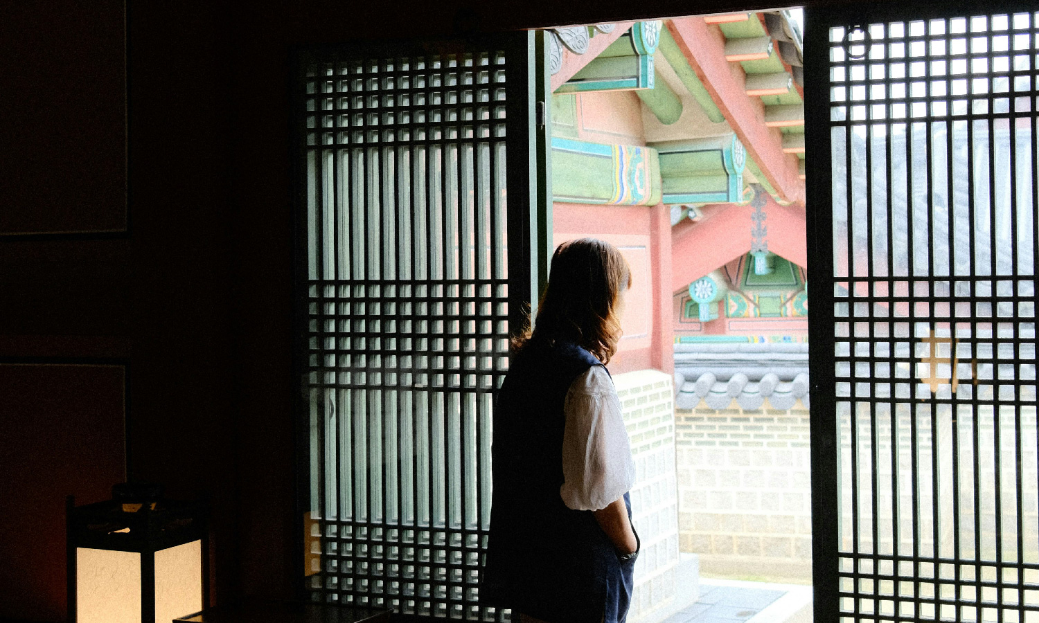inside a traditional building looking out on ornate building.