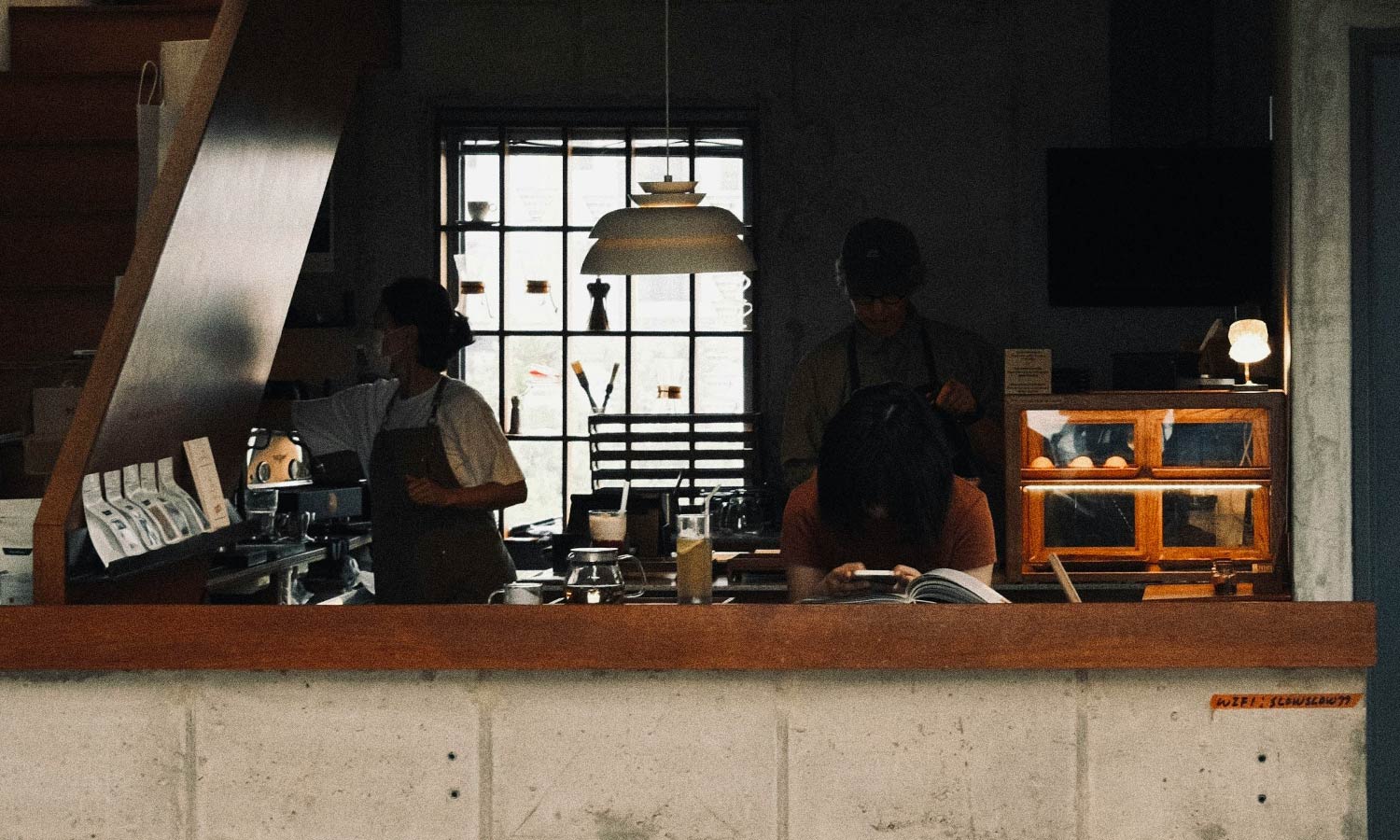 Looking into a cozy coffee shop from outside.